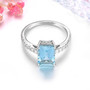 front view of emerald cut aquamarine and diamond ring in 14k white gold