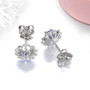 back view of tanzanite and zircon round halo stud earrings on rhodium over sterling silver