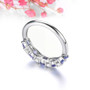 back view of tanzanite and white zircon band ring in rhodium over sterling silver