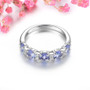 side view of tanzanite and white zircon band ring in rhodium over sterling silver