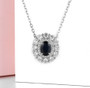 sapphire and zircon double halo necklace in rhodium over sterling silver shown in a lifestyle photo