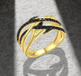 black spinel openwork band ring in 18k yellow gold over sterling silver shown in a lifestyle photo