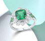 lab green spinel and cubic zirconia ring in rhodium over sterling silver shown in a lifestyle photo