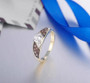 brown and white cubic zirconia wedding ring in 18k yellow gold over sterling silver shown in a lifestyle photo