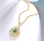 lab spinel and cz halo necklace in 18k yellow gold over sterling silver shown in a lifestyle photo