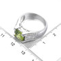 peridot and white zircon bridge ring in rhodium over sterling silver shown for size comparison