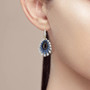 black spinel lab blue spinel and cz halo earrings in 18k yellow gold over sterling silver worn on the ear