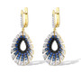 side view of black spinel lab blue spinel and cz halo earrings in 18k yellow gold over sterling silver