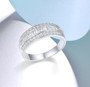 princess cut and round cut cubic zirconia 6mm wedding band ring in rhodium over sterling silver shown in a lifestyle photo