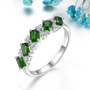 chrome diopside and white zircon band ring in rhodium over sterling silver shown in a lifestyle photo