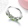 back view of oval chrome diopside and white zircon band ring in rhodium over sterling silver