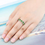 oval chrome diopside and white zircon band ring in rhodium over sterling silver worn on a hand