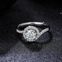 front view of moissanite round bypass ring in rhodium over sterling silver