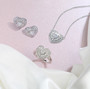 close up of moissanite heart halo ring in rhodium over sterling silver