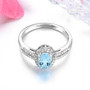 front view of aquamarine and diamond oval halo ring in 14k white gold