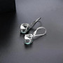 back view of green fluorite dangle earrings in rhodium over sterling silver