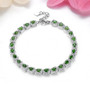 chrome diopside and white zircon halo bracelet in rhodium over sterling silver shown in a lifestyle photo