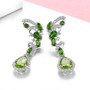 side view of peridot chrome diopside and white zircon earrings in rhodium over sterling silver