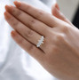 marquise moissanite band ring in 10k yellow gold worn on a hand