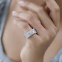 moissanite three row cluster band ring in rhodium over sterling silver worn on a hand