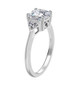 side view of moissanite round trilogy ring in rhodium over sterling silver