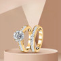 close up of moissanite two ring stackable bridal set in 18k yellow gold over sterling silver