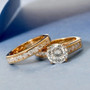moissanite two ring stackable bridal set in 18k yellow gold over sterling silver shown in a lifestyle photo