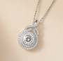 round moissanite cluster necklace in rhodium over sterling silver shown in a lifestyle photo