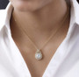 round moissanite cluster necklace in 18k yellow gold over sterling silver worn around the neck