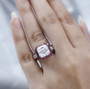 asscher cut moissanite and ruby halo ring in rhodium over sterling silver worn on a hand