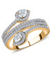 pear and round moissanite bypass ring in 18k yellow gold over sterling silver
