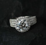 round halo moissanite wedding ring in rhodium over sterling silver shown in a lifestyle photo