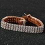 moissanite triple row tennis bracelet in 18k rose gold over sterling silver shown in a lifestyle photo