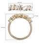 mixed shape moissanite band ring in 10k yellow gold shown for size comparison