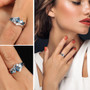 london sky blue topaz and white zircon rhodium over sterling silver bypass ring worn on a hand