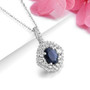 close up of oval sapphire and white zircon double halo necklace in rhodium over sterling silver