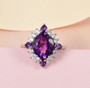 amethyst and white zircon halo ring in rhodium over sterling silver shown in a lifestyle photo