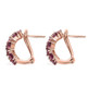 side view of rhodolite garnet and moissanite cluster earrings in 18k rose gold over sterling silver