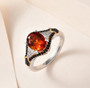 madeira citrine black spinel and zircon ring in 18k yellow gold and rhodium over sterling silver shown in a lifestyle photo