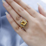 heliodor ring with champagne and white diamonds in 18k yellow gold over sterling silver worn on a hand