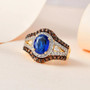 blue spinel brown zircon and white zircon ring in 18k yellow gold over sterling silver shown in a lifestyle photo
