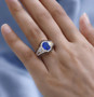 blue spinel brown zircon and white zircon ring in 18k yellow gold over sterling silver worn on a hand
