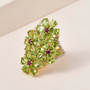 peridot rhodolite garnet and zircon flower ring in 18k yellow gold over sterling silver shown in a lifestyle photo