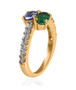 side view of emerald tanzanite and moissanite bypass ring in 18k yellow gold over sterling silver