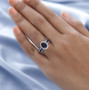 iolite brown zircon and white zircon ring in rhodium over sterling silver worn on a hand