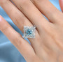 blue and white zircon ring in rhodium over sterling silver worn on a hand