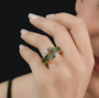 prasiolite and chrome diopside ring in 18k yellow gold over sterling silver worn on a hand