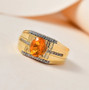 fire opal and white zircon gents ring in 18k yellow gold over sterling silver shown in a lifestyle photo