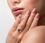 round chrome diopside and diamond ring in 14k yellow gold worn on a hand