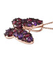 side view of rhodolite garnet and amethyst butterfly pendant necklace in 18k rose gold over sterling silver
